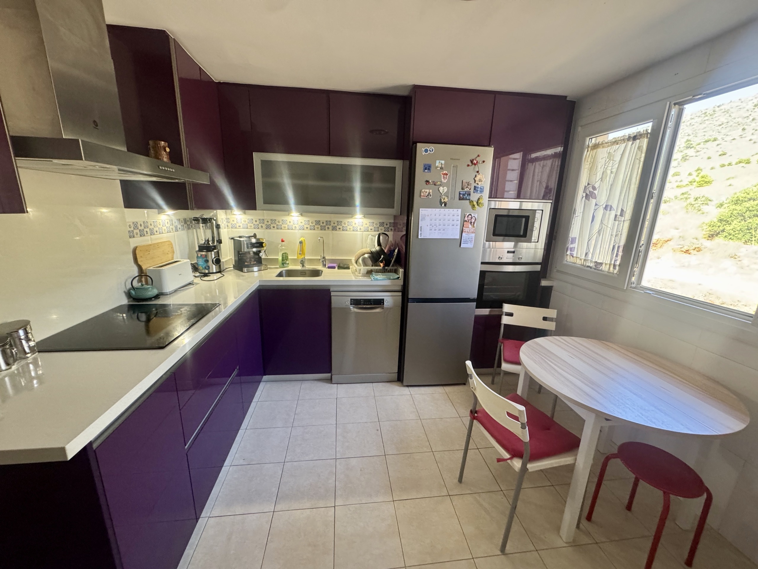 Cocina independiente con lavadero en ático dúplex